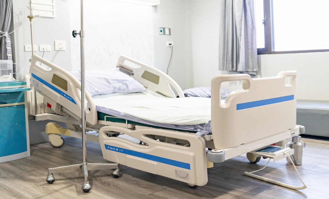 Hospital bed remote control hanging on the bed rail. technology Hospital.
